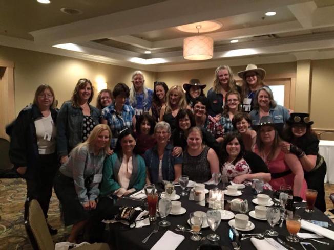 The ABOotlanders who attended pose with Diana at the Western Themed Banquet